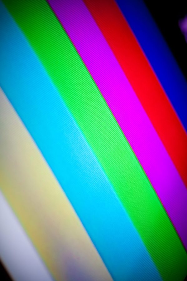Closeup of a standard picture tube tv set with the rainbow color bars displayed.